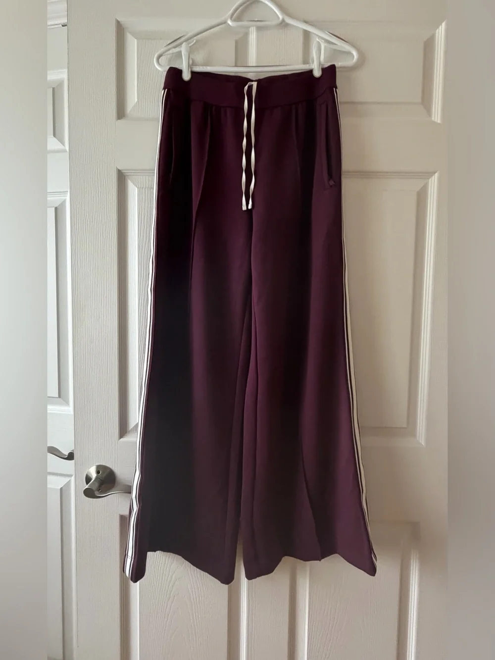 ALO Yoga Wide-Leg Track Pants in Plum with White Side Stripes - Picture 2 of 10